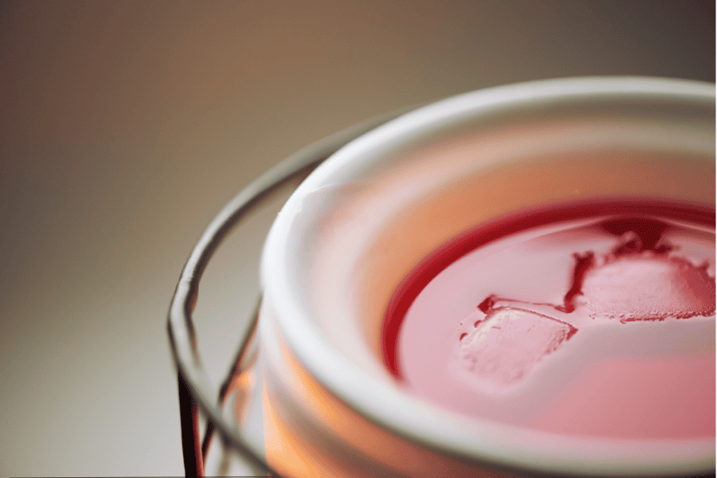 Red melted wax in a wax warmer dish