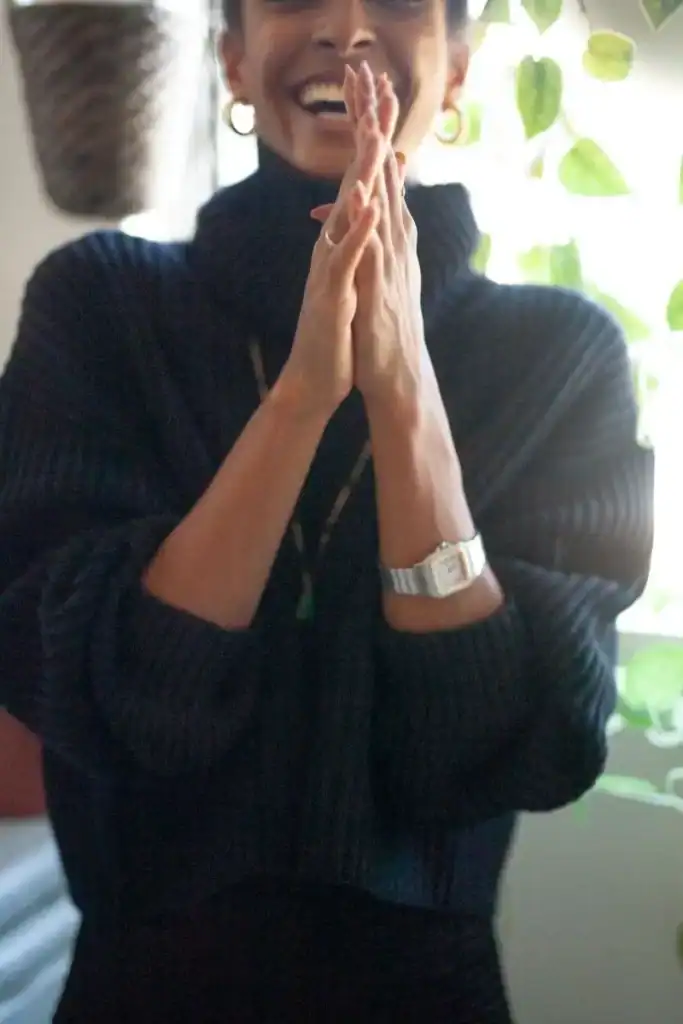 Woman smiling with a peaceful, joyful expression, representing how to let go and let God in a relationship during midlife